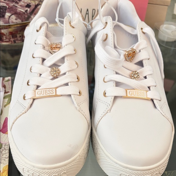NWT Guess Colton charms woman’s sneakers white and gold size 11.